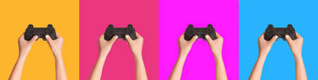 Creative collage with video gaming consoles in female hands, colorful background. Panoramaの写真素材