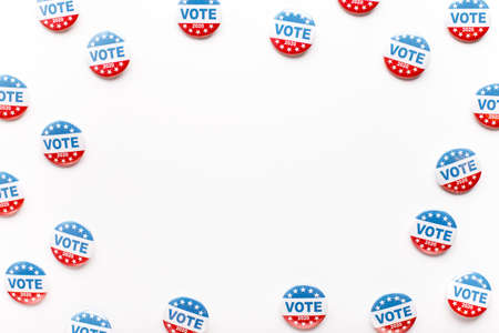 Round frame of red, white, and blue vote buttons on background, US elections 2020の写真素材
