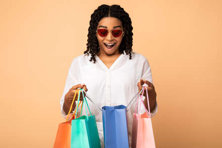 Shopping Concept. Joyful African Woman Holding Colorful Shopper Bags Excited About Sales And...