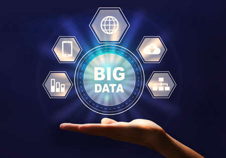 Male hand holding big data network inforgaphic icons on palm over dark background, creative collageの写真素材
