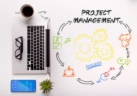 Top view of stylish workspace with laptop, coffee and cellphone and project management process...