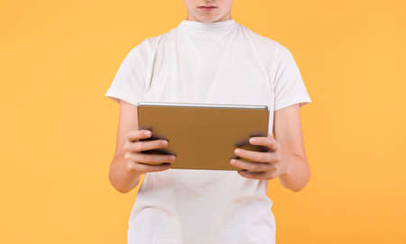 App For Students. Closeup cropped view of unrecognizable guy holding and using digital tablet,...
