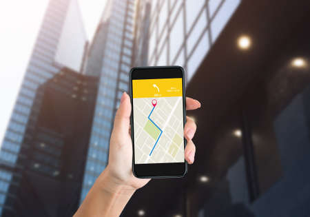 Navigation App. Female Hand Holding Phone With GPS Navigator Application On Smartphone Screen...