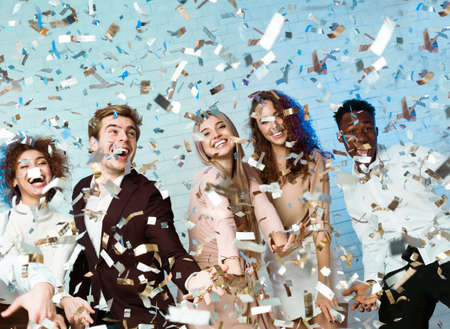 Party People. Happy Friends Having Fun Partying Enjoying Falling Confetti Celebrating New Year...