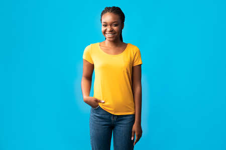 Happy African Millennial Woman With Brackets Smiling Looking At Camera Standing Holding Hand In...