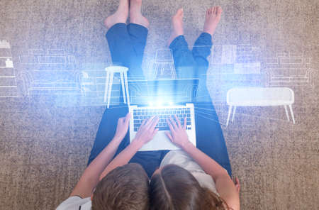 Young Couple Using Laptop With Digital Augmented Reality Furniture Hologram, Choosing Virtual...