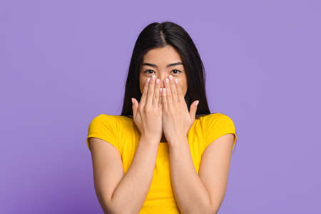 Happy Excitement. Shy Asian Woman Covering Mouth With Hands, Emotionally Reacting To Pleasant...