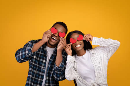 Natural emotions of love, romantic and valentine day. Cheerful african american couple smiling, have...
