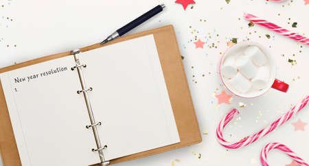 New Year Resolution. Creative Holiday Background With Opened Notepad, Cocoa With Marshmallows, Candy...