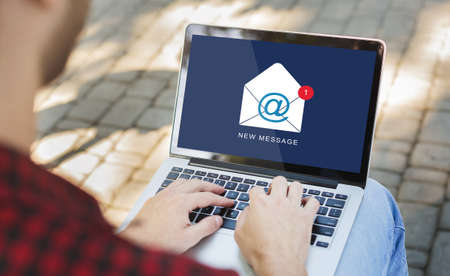 Unrecognizable Guy Using Laptop Reading New E-Mail Message On Computer Communicating Online Sitting...