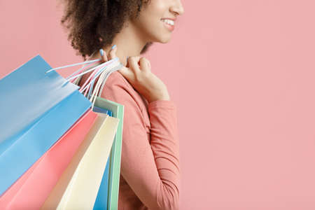 Happy emotions from shopping in free time, cool purchases and sale. Millennial african american...