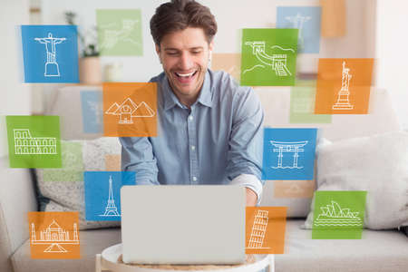 Online Sightseeing Tour. Happy Man Using Laptop Computer Browsing Travel Destinations Sitting At...