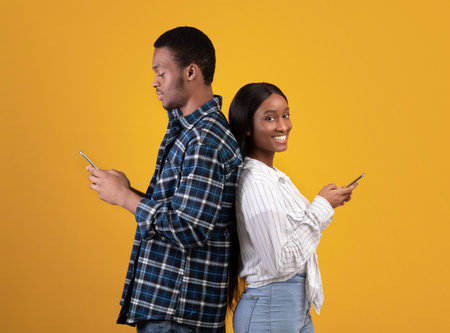 Relationships, social networks and surfing in internet. Young african american male and female stand...