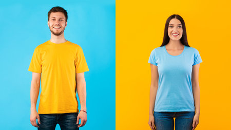 Portrait of young man and woman smiling, looking and posing at camera isolated over blue and yellow halved studio background. Confident couple with happy facial expression showing positive emotionsの写真素材