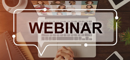 Webinar inscription over colorful image of unrecognizable caucasian man holding hands on laptop, having training online or listening to webinar, top view, office interior, collage, panoramaの写真素材