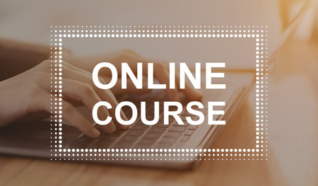 Online course inscription in frame over young woman freelancer hands typing on laptop keyboard, online education, webinar, e-education during lockdown concept, panorama, illustrative imageの写真素材