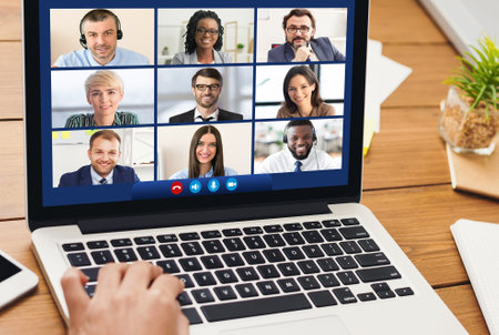 Online Business Meeting. Woman At Laptop Communicating With Coworkers Sitting At Desk Indoor. Office...
