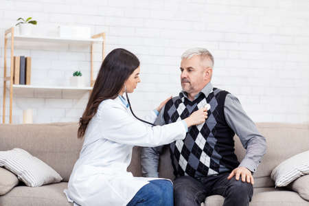 Protection of health of senior patient and risk group, colds and heart disease. Young woman doctor...