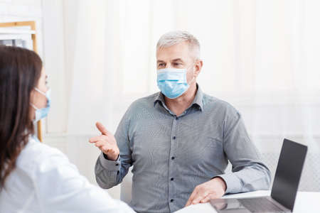 Health care and modern examination by doctor during covid-19 lockdown. Adult male patient in...