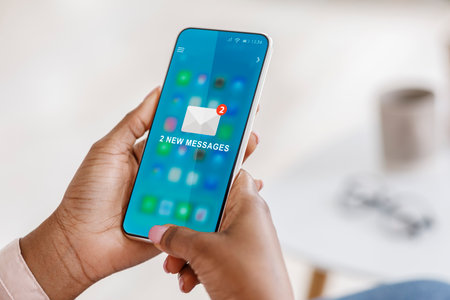 New Messages. Black Woman Using Smartphone With New E-Mail Message Notification Sitting In Office. Email Chain And Networking, Social Media Mail Application, Modern Online Communication. Croppedの写真素材