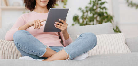 Big sale, great offer, mobile app, modern chat and surfing in internet at home. Happy teen african...