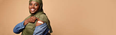 Vaccinated African American Muslim Lady Showing Arm, Beige Background