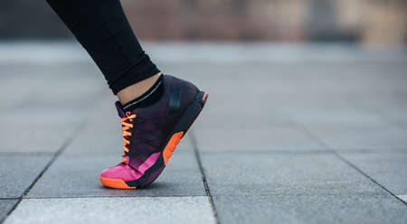 Training outdoor season and active workout and jogging in city, body care in summerの写真素材