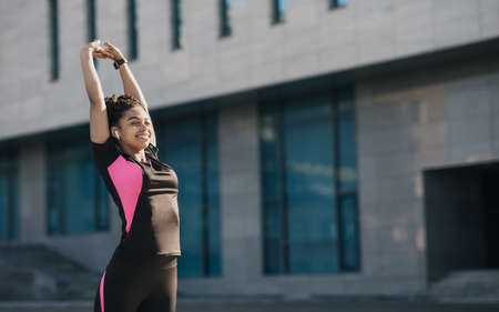Exercises stretching body muscles in city, healthy lifestyleの写真素材