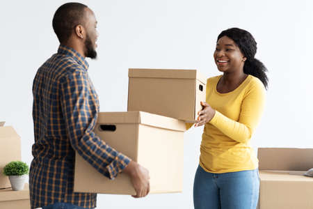 Relocation Day. Portrait Of Happy African American Couple Carrying Cardboard Boxes