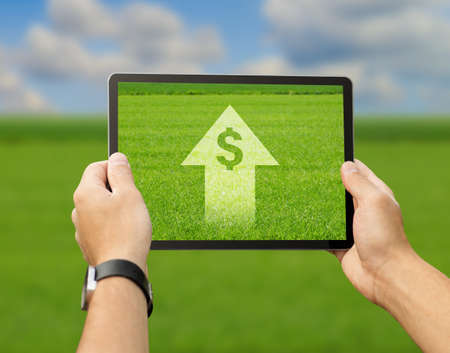 Farmer using digital tablet for agribusiness processes automatizationの写真素材
