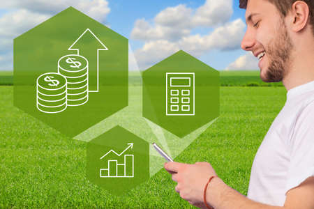 Closeup of man farmer using smart farming app on smartphone