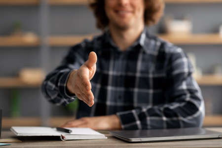 HR Manager Man Stretching Hand For Handshake Greeting In Officeの写真素材