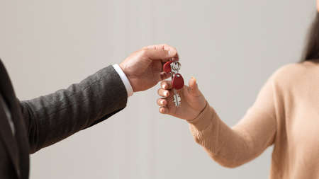 Real Estate Agent Giving Keys To Buyer