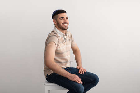 Jewish Man Showing Vaccinated Arm After Antiviral Injection, Studio Backgroundの写真素材