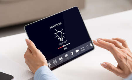 Smart home managing, lighting level and remote control, modern comfortable apartment and mobile...