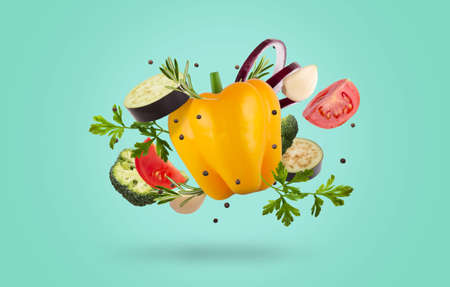 Se tof raw organic vegetables and greens over blueの写真素材