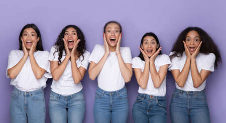 Five Multiracial Ladies Shouting In Excitement On Purple Studio Backgroundの写真素材