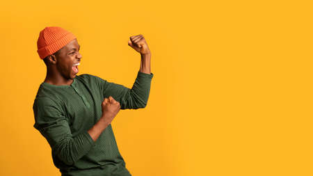 Big Luck. Overjoyed Excited Young African-American Man Rejoicing Success With Raised Fists