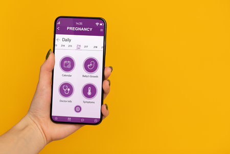 Pov of pregnant woman showing mobile application for pregnancy