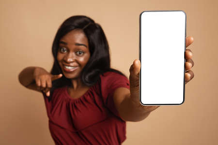 Selective focus on smartphone with empty screen in female handの写真素材