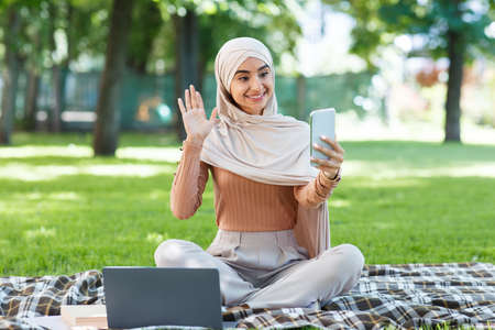 New normal, social distance, devices for work and online meeting outdoor