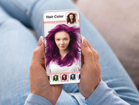 Young woman with purple hair on mobile phone screen