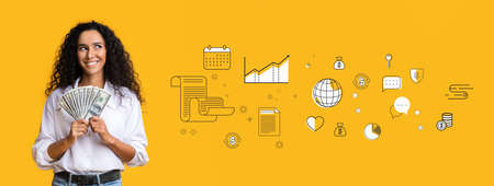 Happy Latin woman holding dollar cash, celebrating financial success, collage with business and money iconsの写真素材