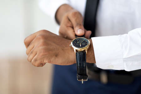 African American businessman wearing expensive wrist watchの写真素材