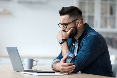 Attractive tired bored programmer digital specialist manager work remotely online overtime