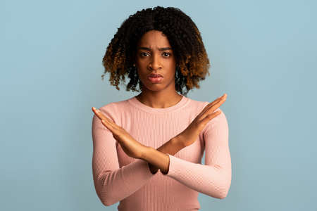 Refusal. Serious Black Female Showing Stop Gesture With Crossed Handsの写真素材