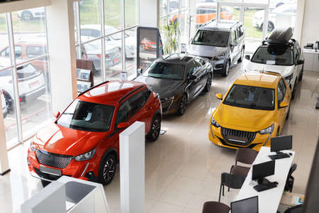 Beautiful modern cars at luxury dealership salon, view above