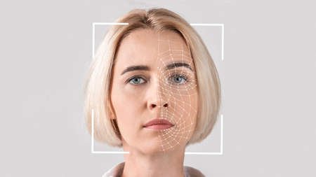 Interface, software for face recognition of young serious blonde ladyの写真素材