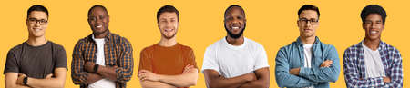 Calm confident successful young caucasian and african american guys with crossed arms on chest looking at cameraの写真素材