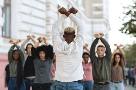 Unrecognizable african american guy leading group of protestorsの写真素材
